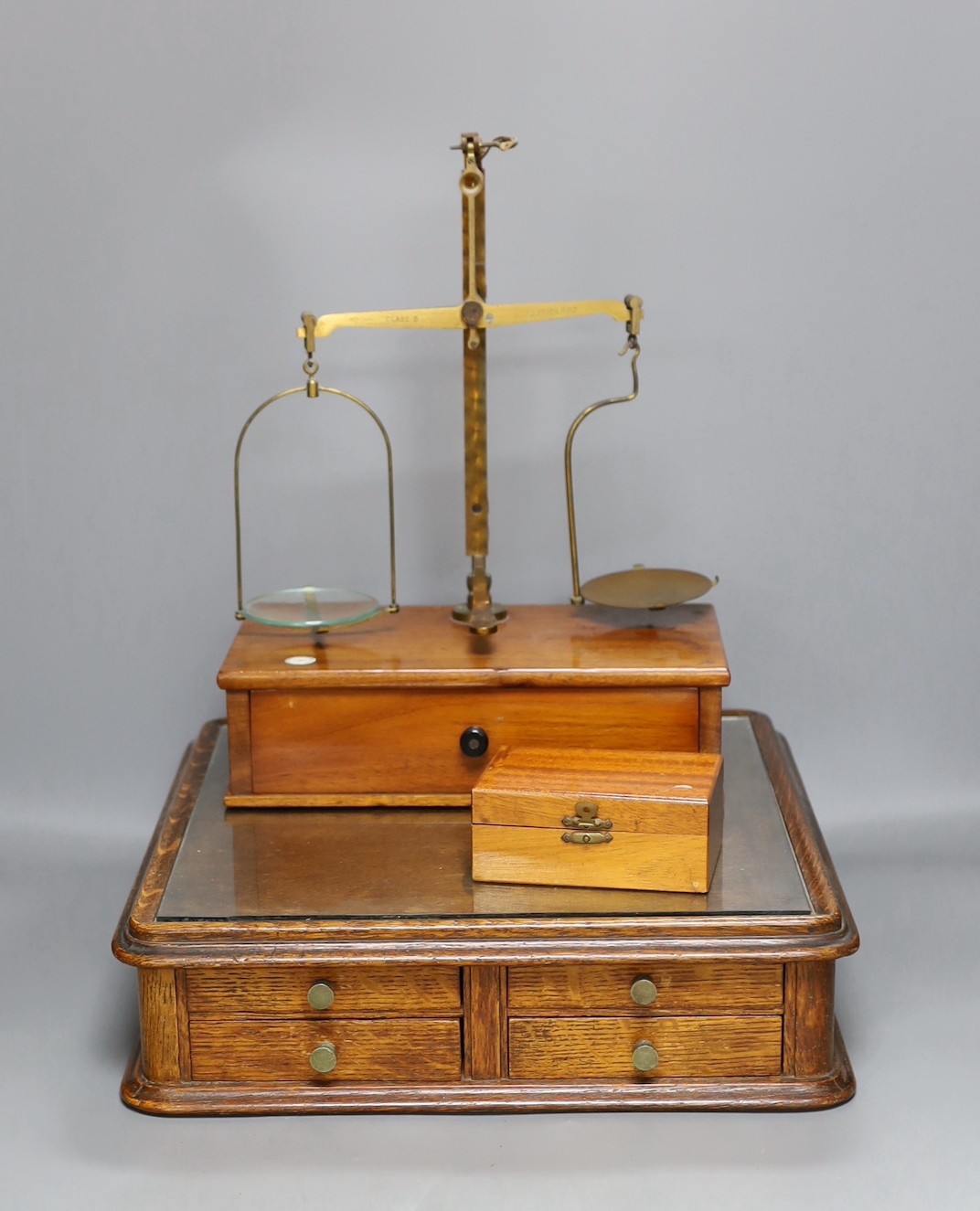 A Victorian oak instrument stand and a set of Stanley scales with weights